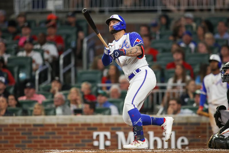 May 6, 2023; Atlanta, Georgia, USA; Atlanta Braves left fielder Kevin Pillar (17) hits a two-run home run against the Baltimore Orioles in the eighth inning at Truist Park. Mandatory Credit: Brett Davis-USA TODAY Sports
