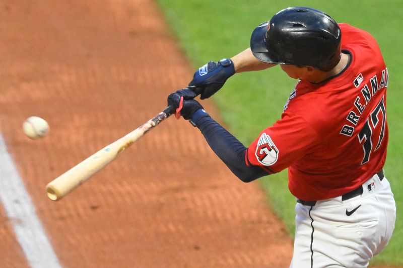 Sep 24, 2024; Cleveland, Ohio, USA; Cleveland Guardians right fielder Will Brennan (17) singles in the second inning against the Cincinnati Reds at Progressive Field. Mandatory Credit: David Richard-Imagn Images