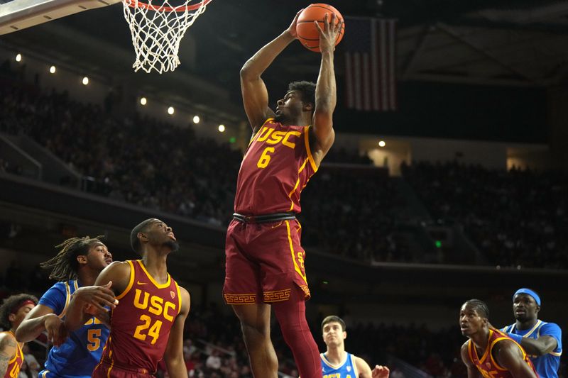 Jan 27, 2024; Los Angeles, California, USA; Southern California Trojans guard Bronny James (6) rebounds the ball against the UCLA Bruins  in the first half at Galen Center. Mandatory Credit: Kirby Lee-USA TODAY Sports