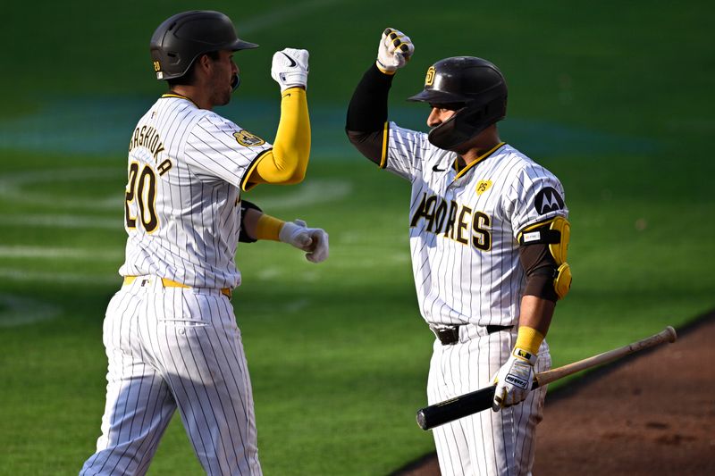 Jun 22, 2024; San Diego, California, USA; San Diego Padres catcher Kyle Higashioka (left) is congratulated by designated hitter Donovan Solano (39) after hitting a two-run home run against the Milwaukee Brewers during the seventh inning at Petco Park. Mandatory Credit: Orlando Ramirez-USA TODAY Sports