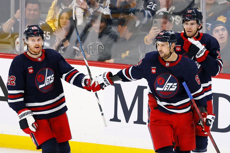 Oct 20, 2024; Winnipeg, Manitoba, CAN; Winnipeg Jets right wing Nino Niederreiter (62)  celebrates his third period goal with Winnipeg Jets center Mason Appleton (22) against the Pittsburgh Penguins at Canada Life Centre. Mandatory Credit: James Carey Lauder-Imagn Images