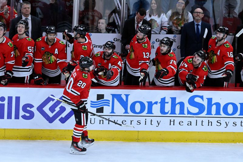 Jan 16, 2024; Chicago, Illinois, USA; Chicago Blackhawks center Rem Pitlick (20) celebrates with teammates after he scores past San Jose Sharks goaltender Mackenzie Blackwood (29) during  the overtime period at United Center. Mandatory Credit: Matt Marton-USA TODAY Sports