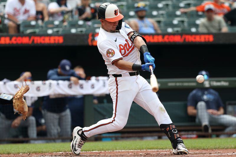 Jun 29, 2025; Baltimore, Maryland, USA; Baltimore Orioles third baseman Ramon Urias (29) hits a double during the seventh inning against the Tampa Bay Rays at Oriole Park at Camden Yards. Mandatory Credit: Daniel Kucin Jr.-Imagn Images