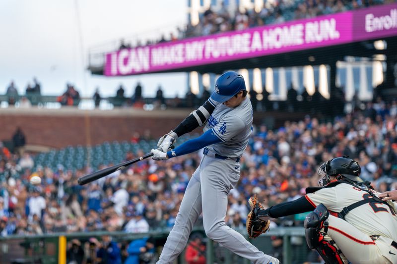 May 13, 2024; San Francisco, California, USA; Los Angeles Dodgers designated hitter Shohei Ohtani (17) hits a single against the San Francisco Giants during the first inning at Oracle Park. Mandatory Credit: Neville E. Guard-USA TODAY Sports