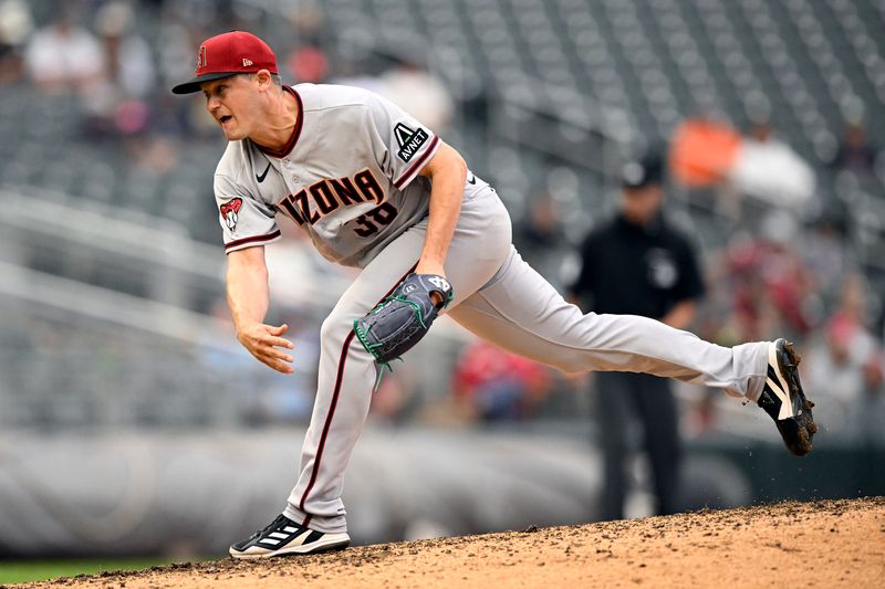 Aug 6, 2023; Minneapolis, Minnesota, USA;  Arizona Diamondbacks pitcher Paul Sewald (38) delivers a pitch against the Minnesota Twins during the ninth inning at Target Field. Mandatory Credit: Nick Wosika-USA TODAY Sports