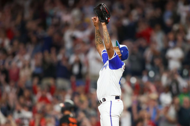 May 6, 2023; Atlanta, Georgia, USA; Atlanta Braves relief pitcher Raisel Iglesias (26) celebrates after a victory against the Baltimore Orioles at Truist Park. Mandatory Credit: Brett Davis-USA TODAY Sports