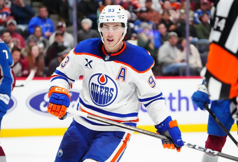 Nov 30, 2024; Denver, Colorado, USA; Edmonton Oilers center Ryan Nugent-Hopkins (93) following his empty net goal in the third period against the Colorado Avalanche at Ball Arena. Mandatory Credit: Ron Chenoy-Imagn Images