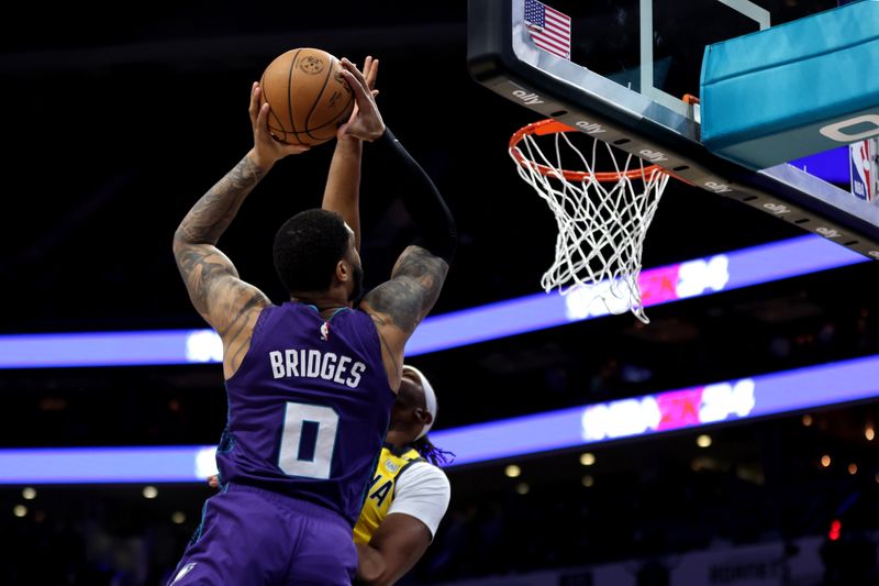 CHARLOTTE, NORTH CAROLINA - FEBRUARY 12: Miles Bridges #0 of the Charlotte Hornets lays the ball up during the first half of an NBA game against the Indiana Pacers at Spectrum Center on February 12, 2024 in Charlotte, North Carolina. NOTE TO USER: User expressly acknowledges and agrees that, by downloading and or using this photograph, User is consenting to the terms and conditions of the Getty Images License Agreement. (Photo by David Jensen/Getty Images)