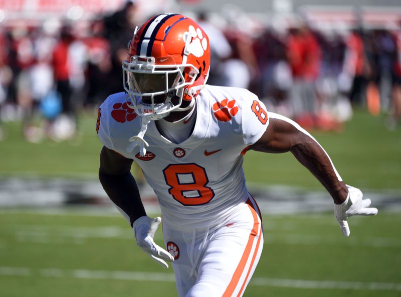 Sep 25, 2021; Raleigh, North Carolina, USA; Clemson Tigers receiver Justyn Ross (8) warms up prior to a game against the North Carolina State Wolfpack at Carter-Finley Stadium. Mandatory Credit: Rob Kinnan-USA TODAY 