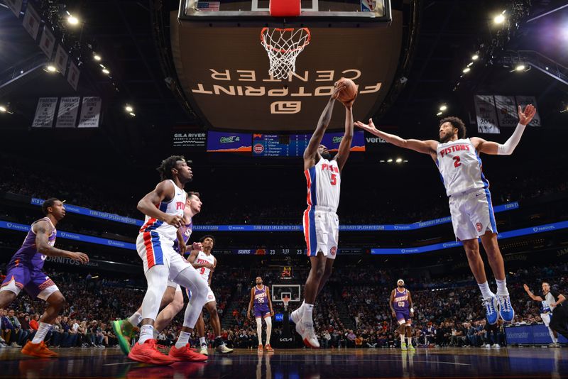 PHOENIX, AZ - FEBRUARY 14:  Shake Milton #5 of the Detroit Pistons grabs a rebound during the game against the Phoenix Suns on February 14, 2024 at Footprint Center in Phoenix, Arizona. NOTE TO USER: User expressly acknowledges and agrees that, by downloading and or using this photograph, user is consenting to the terms and conditions of the Getty Images License Agreement. Mandatory Copyright Notice: Copyright 2024 NBAE (Photo by Barry Gossage/NBAE via Getty Images)