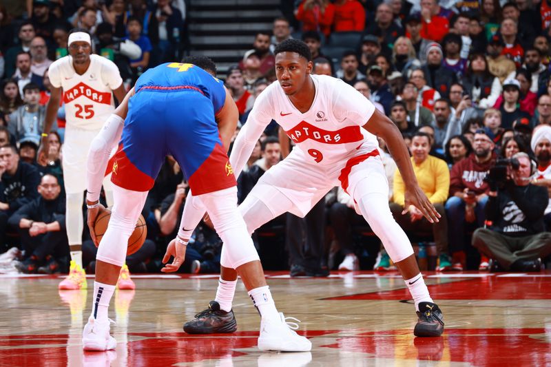 TORONTO, CANADA - OCTOBER 28: RJ Barrett #9 of the Toronto Raptors defends during the game against the Denver Nuggets on October 28, 2024 at the Scotiabank Arena in Toronto, Ontario, Canada.  NOTE TO USER: User expressly acknowledges and agrees that, by downloading and or using this Photograph, user is consenting to the terms and conditions of the Getty Images License Agreement.  Mandatory Copyright Notice: Copyright 2024 NBAE (Photo by Vaughn Ridley/NBAE via Getty Images)