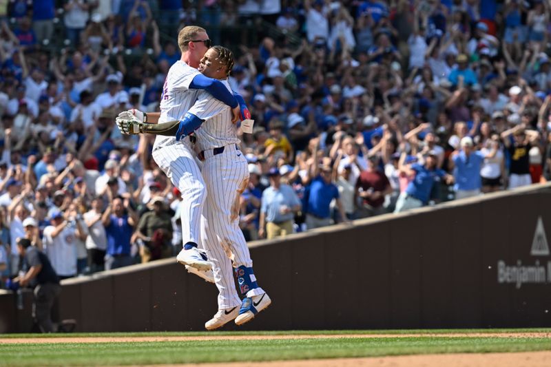 May 18, 2024; Chicago, Illinois, USA; Chicago Cubs outfielder Pete Crow-Armstrong (52) hugs third base Christopher Morel (5) after Morel hit a game winning RBI single against the Pittsburgh Pirates at Wrigley Field. Mandatory Credit: Matt Marton-USA TODAY Sports