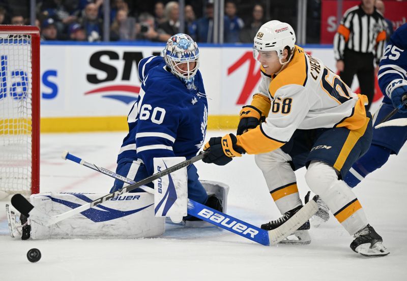 Dec 4, 2024; Toronto, Ontario, CAN;  Toronto Maple Leafs goalie Joseph Woll (60) makes a save against Nashville Predators forward Zachary L'Heureux (68) in the second period at Scotiabank Arena. Mandatory Credit: Dan Hamilton-Imagn Images