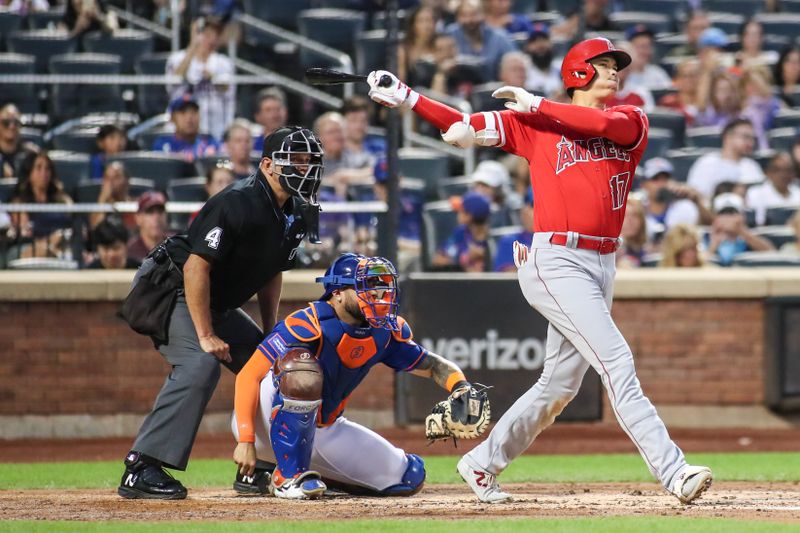 Aug 26, 2023; New York City, New York, USA;  Los Angeles Angels designated hitter Shohei Ohtani (17) hits an RBI triple in the second inning against the New York Mets at Citi Field. Mandatory Credit: Wendell Cruz-USA TODAY Sports