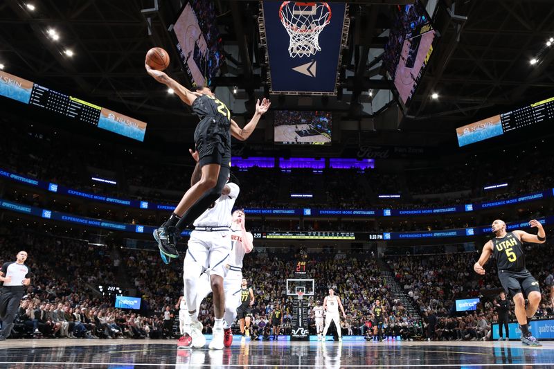 SALT LAKE CITY, UT - APRIL 9: Darius Bazley #21 of the Utah Jazz grabs the rebound during the game against the Denver Nuggets on April 9, 2024 at Delta Center in Salt Lake City, Utah. NOTE TO USER: User expressly acknowledges and agrees that, by downloading and or using this Photograph, User is consenting to the terms and conditions of the Getty Images License Agreement. Mandatory Copyright Notice: Copyright 2024 NBAE (Photo by Melissa Majchrzak/NBAE via Getty Images)