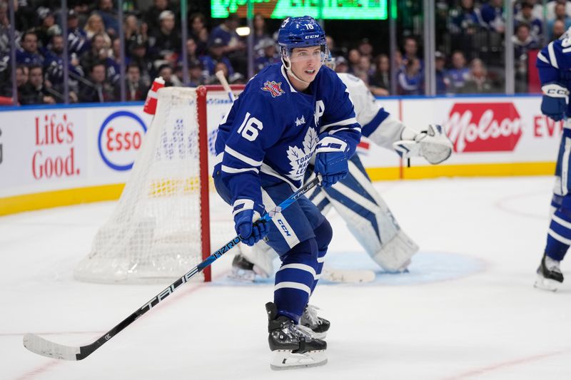 Nov 6, 2023; Toronto, Ontario, CAN; Toronto Maple Leafs forward Mitchell Marner (16) looks for a pass against the Tampa Bay Lightning during the third period at Scotiabank Arena. Mandatory Credit: John E. Sokolowski-USA TODAY Sports