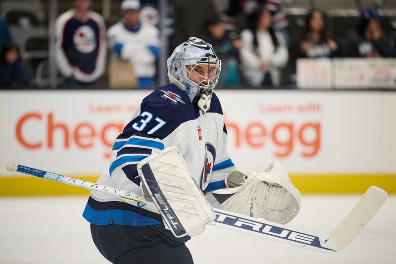 Dec 12, 2023; San Jose, California, USA; Winnipeg Jets goaltender Connor Hellebuyck (37) warms up on the ice before the game between the San Jose Sharks and the Winnipeg Jets at SAP Center at San Jose. Mandatory Credit: Robert Edwards-USA TODAY Sports