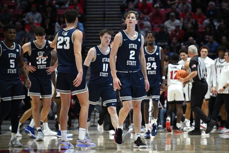 Jan 25, 2023; San Diego, California, USA; Utah State Aggies players react after a timeout is called during the first half against the San Diego State Aztecs at Viejas Arena. Mandatory Credit: Orlando Ramirez-USA TODAY Sports