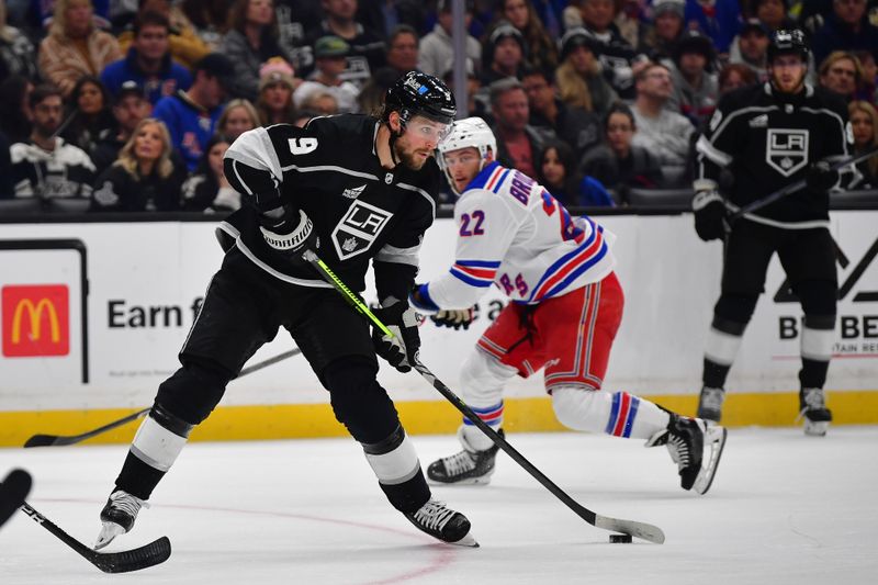 Jan 20, 2024; Los Angeles, California, USA; Los Angeles Kings right wing Adrian Kempe (9) controls the puck against the New York Rangers durng the second period at Crypto.com Arena. Mandatory Credit: Gary A. Vasquez-USA TODAY Sports