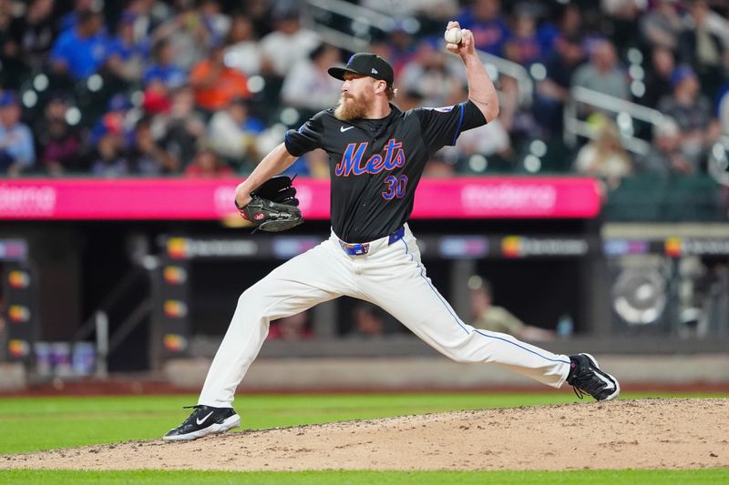 May 31, 2024; New York City, New York, USA; New York Mets pitcher Jake Diekman (30) delivers a pitch against the Arizona Diamondbacks during the seventh inning at Citi Field. Mandatory Credit: Gregory Fisher-USA TODAY Sports