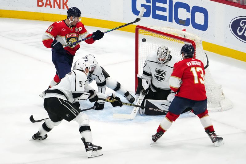 Jan 11, 2024; Sunrise, Florida, USA; Florida Panthers center Sam Reinhart (13) scores the game winning goal past Los Angeles Kings goaltender Cam Talbot (39) with 00.7 seconds left in the overtime period at Amerant Bank Arena. Mandatory Credit: Jasen Vinlove-USA TODAY Sports