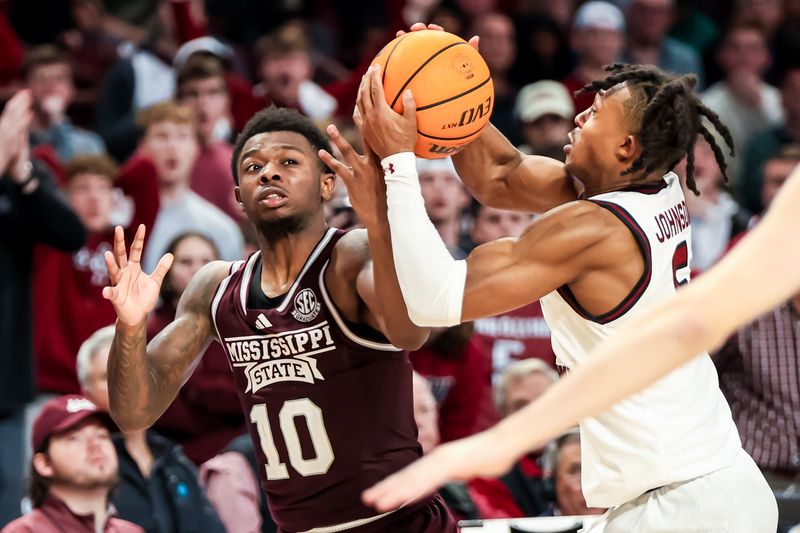 Jan 6, 2024; Columbia, South Carolina, USA; South Carolina Gamecocks guard Meechie Johnson (5) steals the ball from Mississippi State Bulldogs guard Dashawn Davis (10) to seal the Gamecocks victory in the second half at Colonial Life Arena. Mandatory Credit: Jeff Blake-USA TODAY Sports