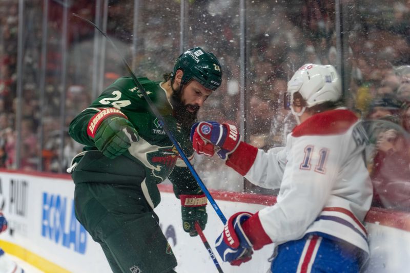 Dec 21, 2023; Saint Paul, Minnesota, USA; Minnesota Wild defenseman Zach Bogosian (24) is checked by Montreal Canadiens right wing Brendan Gallagher (11) in the second period at Xcel Energy Center. Mandatory Credit: Matt Blewett-USA TODAY Sports