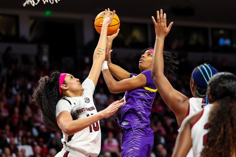 Feb 12, 2023; Columbia, South Carolina, USA; LSU Lady Tigers forward Sa'Myah Smith (5) shoots over South Carolina Gamecocks center Kamilla Cardoso (10) in the second half at Colonial Life Arena. Mandatory Credit: Jeff Blake-USA TODAY Sports