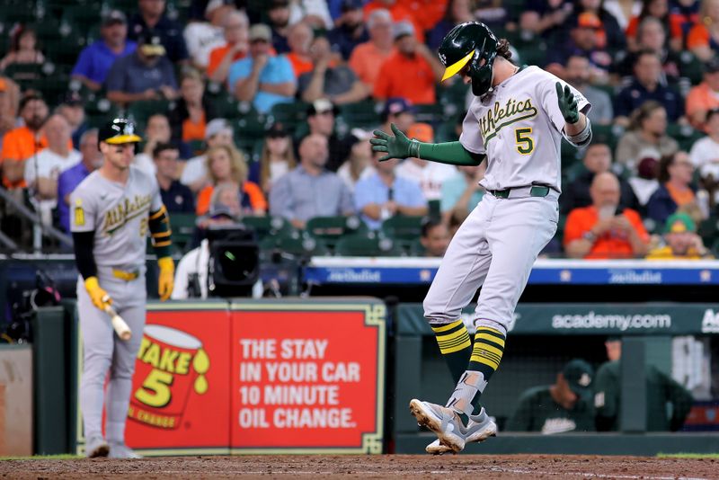 May 28, 2025; Houston, Texas, USA;  Athletics shortstop Jacob Wilson (5) crosses home plate after hitting a home run against the Houston Astros during the fifth inning at Daikin Park. Mandatory Credit: Erik Williams-Imagn Images