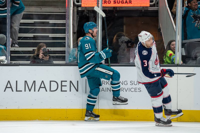 Nov 5, 2024; San Jose, California, USA;  San Jose Sharks right wing Carl Grundstrom (91) celebrates a goal but is later overturned due to an offsides call during the second period against the Columbus Blue Jackets at SAP Center at San Jose. Mandatory Credit: Neville E. Guard-Imagn Images