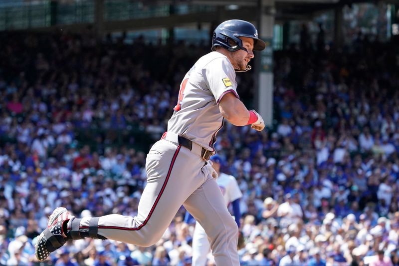 May 23, 2024; Chicago, Illinois, USA; Atlanta Braves outfielder Jarred Kelenic (24) runs the bases after hitting a home run against the Chicago Cubs during the fifth inning at Wrigley Field. Mandatory Credit: David Banks-USA TODAY Sports