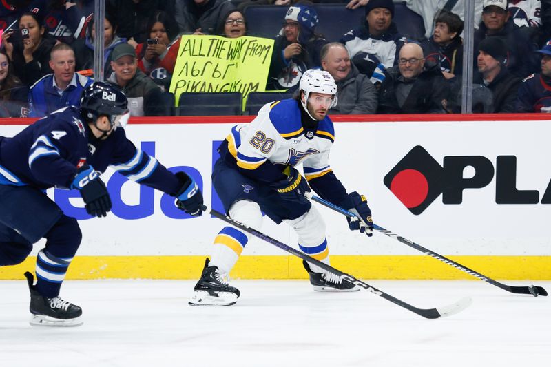 Feb 27, 2024; Winnipeg, Manitoba, CAN; St. Louis Blues forward Brandon Saad (20) skates away from Winnipeg Jets defenseman Neal Pionk (4) during the first period at Canada Life Centre. Mandatory Credit: Terrence Lee-USA TODAY Sports