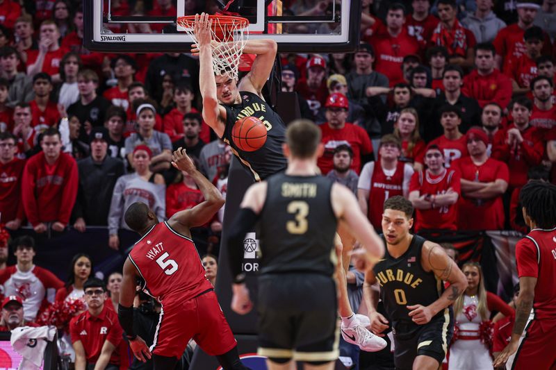 Jan 28, 2024; Piscataway, New Jersey, USA; Purdue Boilermakers center Zach Edey (15) dunks the ball in front of Rutgers Scarlet Knights forward Aundre Hyatt (5) during the second half at Jersey Mike's Arena. Mandatory Credit: Vincent Carchietta-USA TODAY Sports