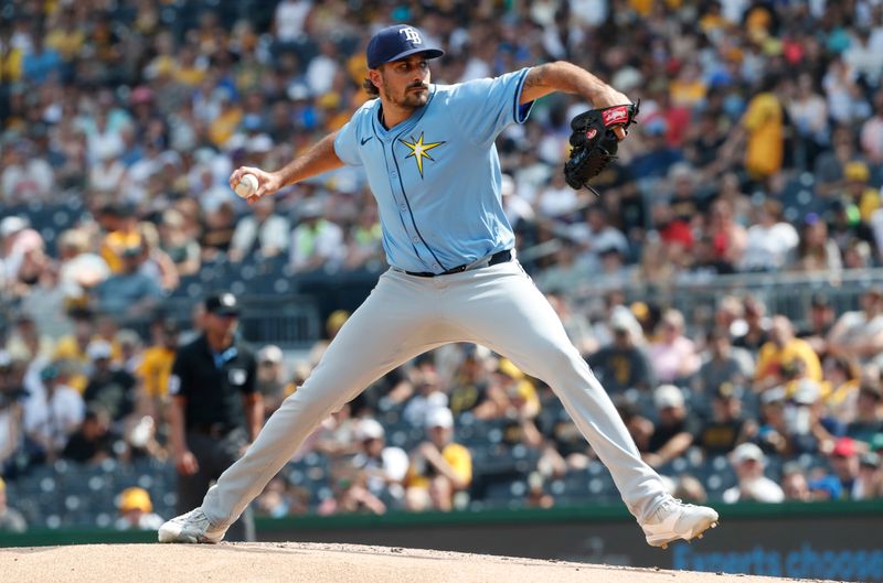 Jun 22, 2024; Pittsburgh, Pennsylvania, USA;  Tampa Bay Rays starting pitcher Zach Eflin (24) delivers a pitch against the Pittsburgh Pirates during the first inning at PNC Park. Mandatory Credit: Charles LeClaire-USA TODAY Sports