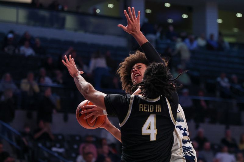 Feb 6, 2024; Atlanta, Georgia, USA; Georgia Tech Yellow Jackets guard Naithan George (2) shoots past Wake Forest Demon Deacons forward Efton Reid III (4) in the second half at McCamish Pavilion. Mandatory Credit: Brett Davis-USA TODAY Sports
