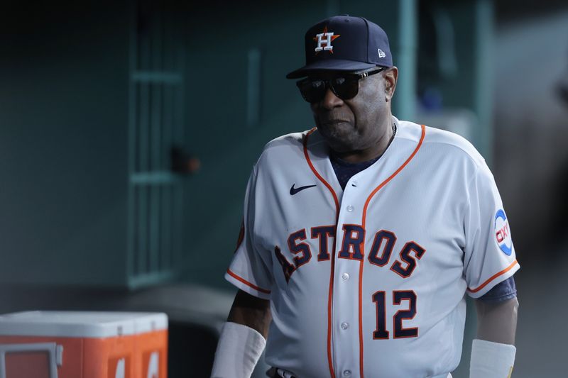 Oct 7, 2023; Houston, Texas, USA; Houston Astros manager Dusty Baker Jr. (12) in the dug out before the game against the Minnesota Twins during game one of the ALDS for the 2023 MLB playoffs at Minute Maid Park. Mandatory Credit: Erik Williams-USA TODAY Sports