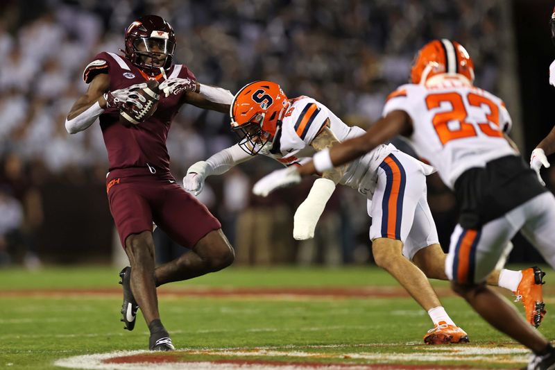 Oct 26, 2023; Blacksburg, Virginia, USA; Virginia Tech Hokies wide receiver Da'Wain Lofton (3) is hit by Syracuse Orange defensive back Justin Barron (8) during the first quarter at Lane Stadium. Mandatory Credit: Peter Casey-USA TODAY Sports