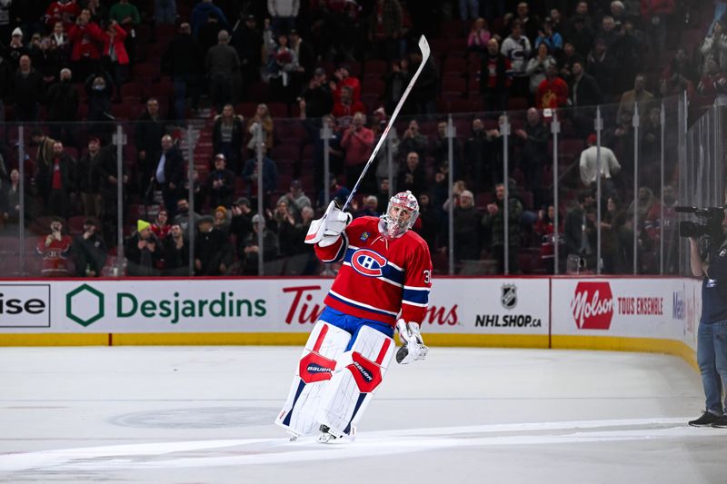 Feb 13, 2024; Montreal, Quebec, CAN; Montreal Canadiens goalie Cayden Primeau (30) third star of the game salutes the crowd after the win against the Anaheim Ducks at Bell Centre. Mandatory Credit: David Kirouac-USA TODAY Sports