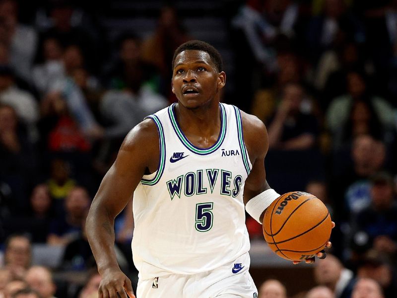 MINNEAPOLIS, MINNESOTA - MARCH 31: Anthony Edwards #5 of the Minnesota Timberwolves brings the ball up court against the Chicago Bulls in the fourth quarter at Target Center on March 31, 2024 in Minneapolis, Minnesota. The Bulls defeated the Timberwolves 109-101. NOTE TO USER: User expressly acknowledges and agrees that, by downloading and or using this photograph, User is consenting to the terms and conditions of the Getty Images License Agreement. (Photo by David Berding/Getty Images)