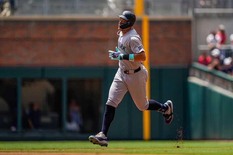 Jul 20, 2025; Cumberland, Georgia, USA; New York Yankees right fielder Aaron Judge (99) runs after hitting a home run against the Atlanta Braves during the first inning at Truist Park. Mandatory Credit: Dale Zanine-Imagn Images