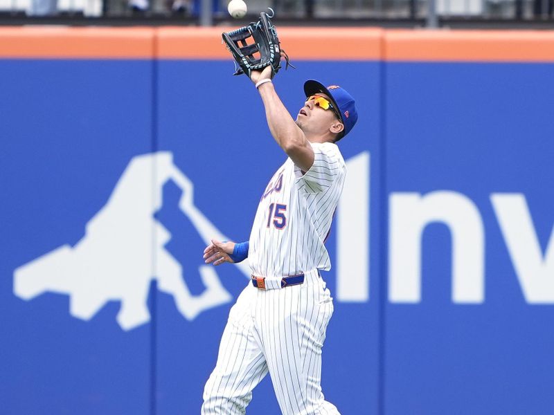 Jun 1, 2025; New York City, New York, USA; New York Mets center fielder Tyrone Taylor (15) catches a fly ball hit by Colorado Rockies left fielder Jordan Beck (27) (not pictured) during the first inning at Citi Field. Mandatory Credit: Gregory Fisher-Imagn Images
