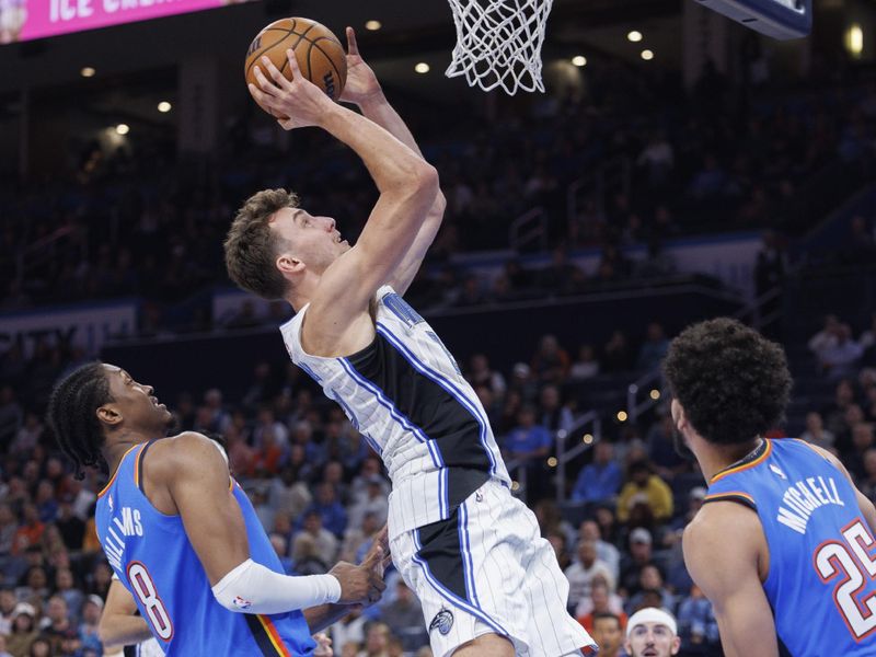 OKLAHOMA CITY, OKLAHOMA - NOVEMBER 4: Franz Wagner #22 of the Orlando Magic goes up for a shot in the second half during a game against the Oklahoma City Thunder at Paycom Center on November 4, 2024 in Oklahoma City, Oklahoma. NOTE TO USER: User expressly acknowledges and agrees that, by downloading and or using this Photograph, user is consenting to the terms and conditions of the Getty Images License Agreement. The Thunder defeated the Magic 102-86.  (Photo by Wesley Hitt/Getty Images)