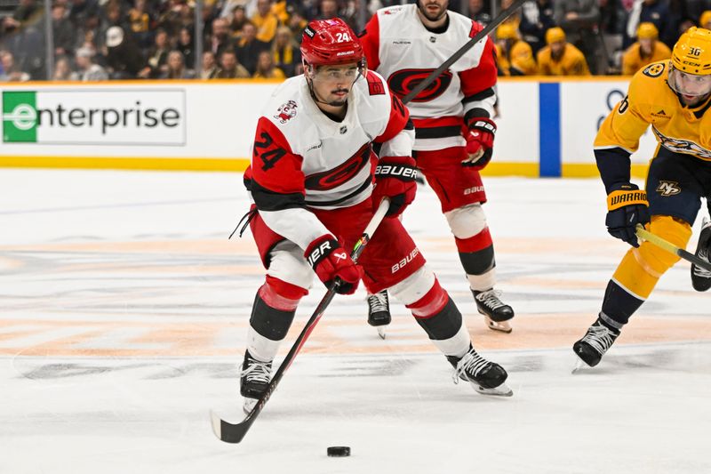 Dec 17, 2025; Nashville, Tennessee, USA;  Carolina Hurricanes center Seth Jarvis (24) skates with the puck against the Nashville Predators during the second period at Bridgestone Arena. Mandatory Credit: Steve Roberts-Imagn Images