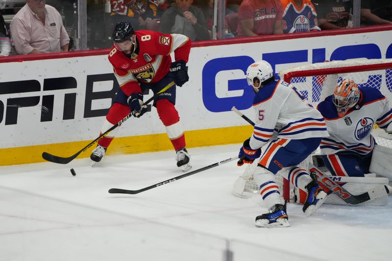 Jun 24, 2024; Sunrise, Florida, USA; Florida Panthers forward Kyle Okposo (8) controls the puck as Edmonton Oilers defenseman Cody Ceci (5) defends during the first period in game seven of the 2024 Stanley Cup Final at Amerant Bank Arena. Mandatory Credit: Jim Rassol-USA TODAY Sports