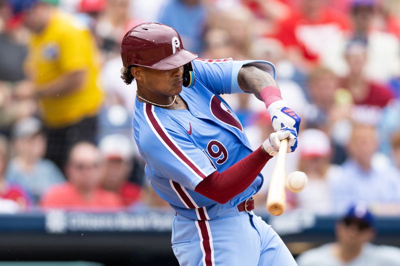 May 23, 2024; Philadelphia, Pennsylvania, USA; Philadelphia Phillies outfielder Cristian Pache (19) hits a two RBI triple during the fourth inning against the Texas Rangers at Citizens Bank Park. Mandatory Credit: Bill Streicher-USA TODAY Sports