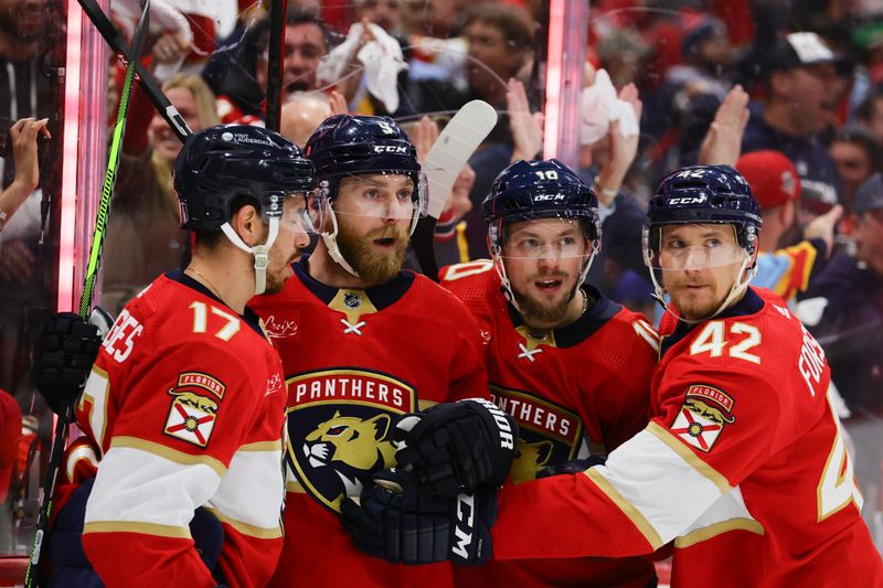 May 28, 2024; Sunrise, Florida, USA; Florida Panthers center Sam Bennett (9) celebrates with center Evan Rodrigues (17), right wing Vladimir Tarasenko (10) and defenseman Gustav Forsling (42) after scoring against the New York Rangers during the second period in game four of the Eastern Conference Final of the 2024 Stanley Cup Playoffs at Amerant Bank Arena. Mandatory Credit: Sam Navarro-USA TODAY Sports