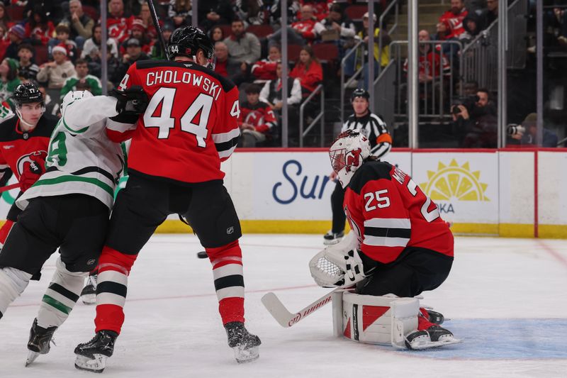 Dec 3, 2025; Newark, New Jersey, USA; New Jersey Devils goaltender Jacob Markstrom (25) makes a save against the Dallas Stars during the first period at Prudential Center. Mandatory Credit: Ed Mulholland-Imagn Images