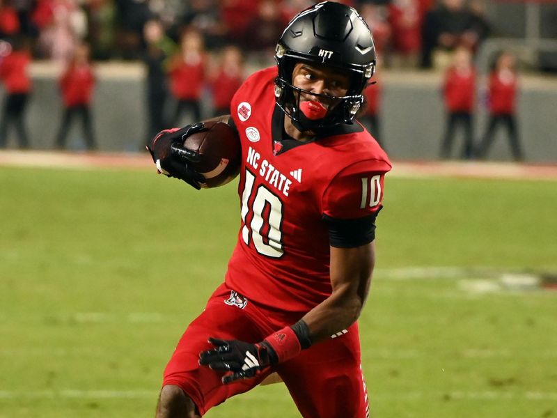 Nov 4, 2023; Raleigh, North Carolina, USA; North Carolina State Wolfpack receiver KC Concepcion (10) runs during the first half against the Miami Hurricanes at Carter-Finley Stadium. Mandatory Credit: Rob Kinnan-USA TODAY Sports