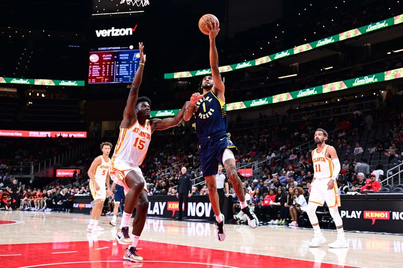 ATLANTA, GA - OCTOBER 8: Obi Toppin #1 of the Indiana Pacers dribbles the ball during the game against the Atlanta Hawks during a NBA preseason game on October 8, 2024 at State Farm Arena in Atlanta, Georgia.  NOTE TO USER: User expressly acknowledges and agrees that, by downloading and/or using this Photograph, user is consenting to the terms and conditions of the Getty Images License Agreement. Mandatory Copyright Notice: Copyright 2024 NBAE (Photo by Adam Hagy/NBAE via Getty Images)