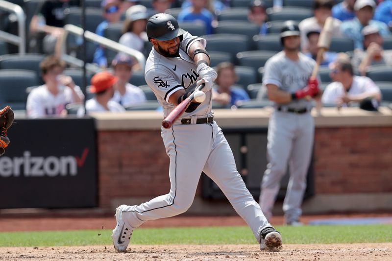 Jul 20, 2023; New York City, New York, USA; Chicago White Sox second baseman Elvis Andrus (1) hits an RBI triple during the sixth inning against the New York Mets at Citi Field. Mandatory Credit: Brad Penner-USA TODAY Sports